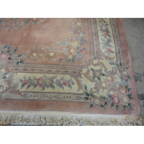 522 - Chinese-style carpet on pink ground.This and the following lots consist of the selected contents of ... 