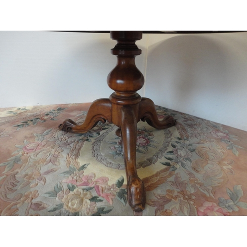 523 - 19th century mahogany breakfast table on tripod base.