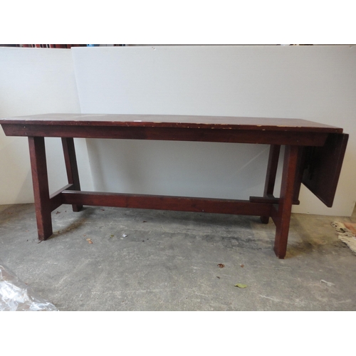 526 - Refectory-style table with drop-leaf to one end.