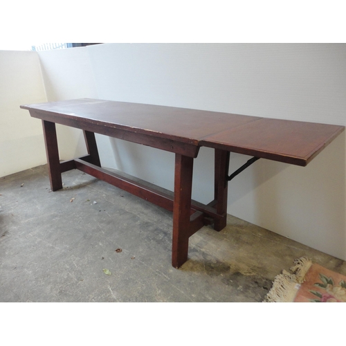 526 - Refectory-style table with drop-leaf to one end.