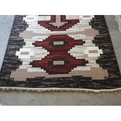 532 - Axminster 'Riga' design multi-coloured rug.