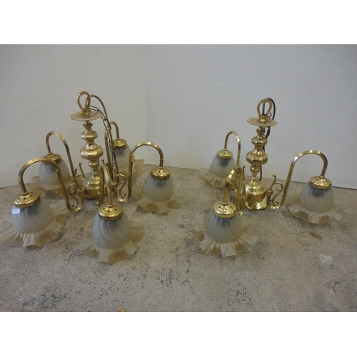 539 - Five-branch brass light fitting and a similar three-branch brass light fitting, both with glass shad... 