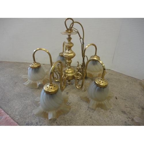 539 - Five-branch brass light fitting and a similar three-branch brass light fitting, both with glass shad... 