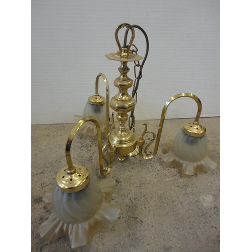 539 - Five-branch brass light fitting and a similar three-branch brass light fitting, both with glass shad... 