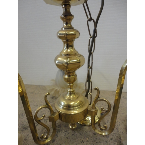 539 - Five-branch brass light fitting and a similar three-branch brass light fitting, both with glass shad... 