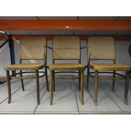 542 - Three matching bentwood bergère cafe chairs, including one carver.  (3)