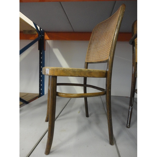 542 - Three matching bentwood bergère cafe chairs, including one carver.  (3)