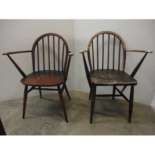 543 - Two Ercol-style elbow chairs.