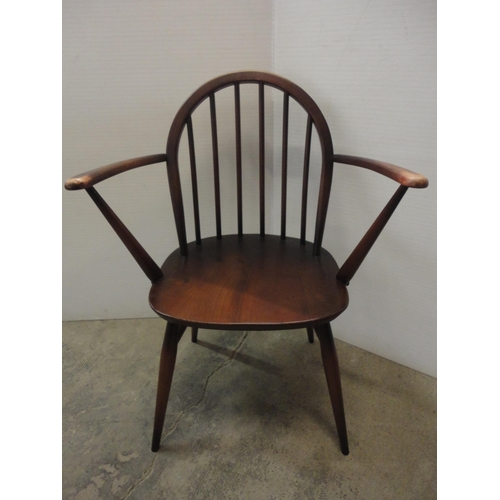 543 - Two Ercol-style elbow chairs.