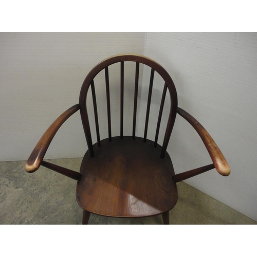 543 - Two Ercol-style elbow chairs.