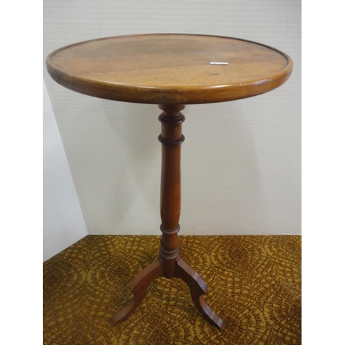 556 - Two antique mahogany occasional tables on tripod bases.