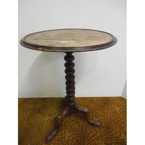 556 - Two antique mahogany occasional tables on tripod bases.