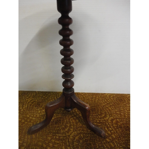 556 - Two antique mahogany occasional tables on tripod bases.