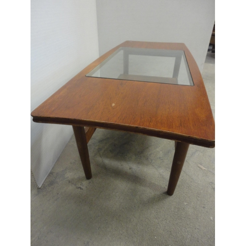 560 - Teak coffee table with glass top.