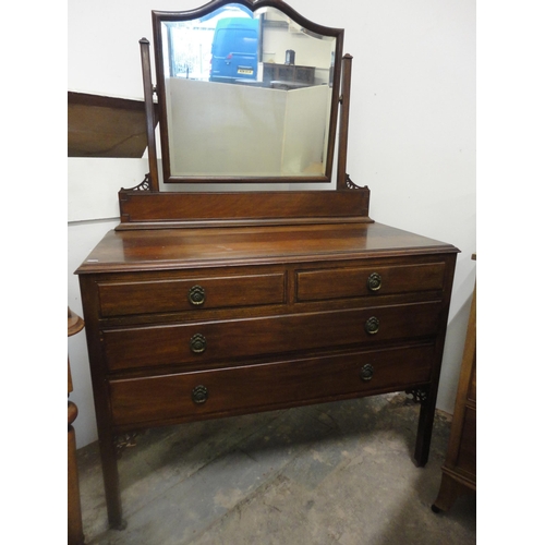 561 - Mahogany dressing chest of two short and two long drawers.