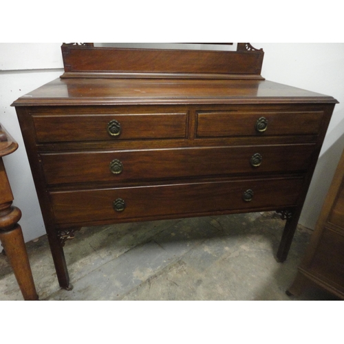 561 - Mahogany dressing chest of two short and two long drawers.