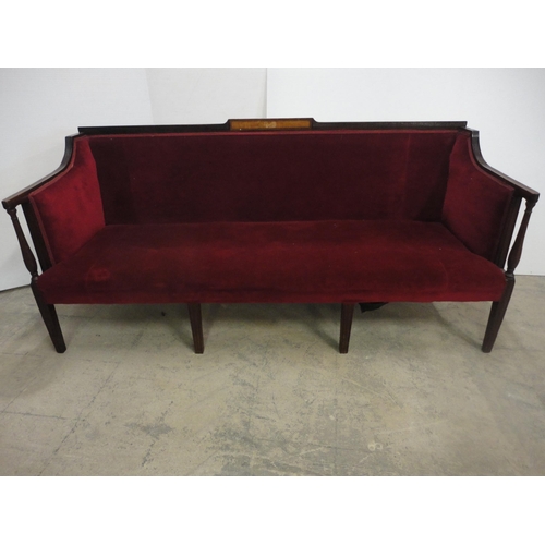 562 - Edwardian sofa upholstered in red velour, on square fluted supports.