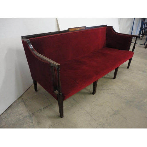 562 - Edwardian sofa upholstered in red velour, on square fluted supports.