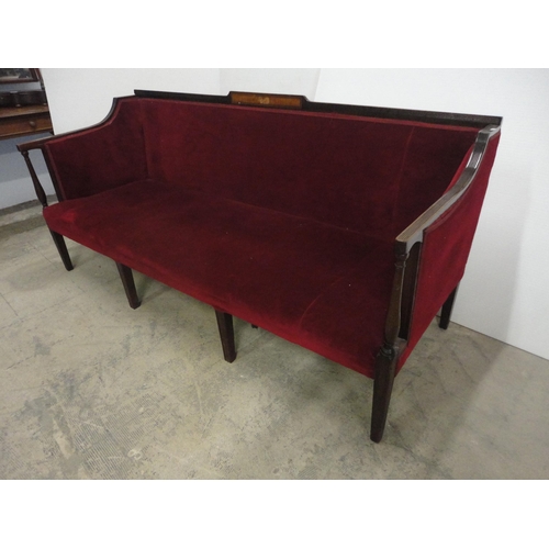 562 - Edwardian sofa upholstered in red velour, on square fluted supports.