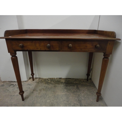 565 - 19th century mahogany wash stand with gallery top.