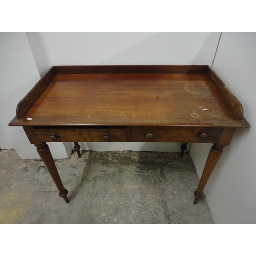 565 - 19th century mahogany wash stand with gallery top.