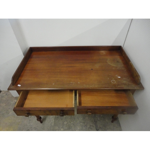 565 - 19th century mahogany wash stand with gallery top.