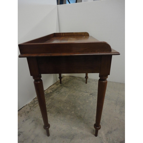 565 - 19th century mahogany wash stand with gallery top.