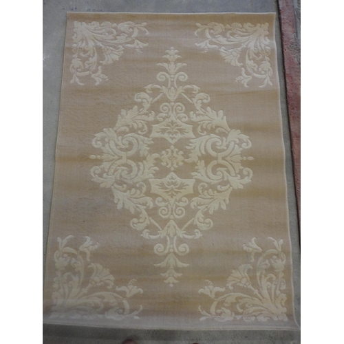 569 - Persian design fawn ground Patina rug.