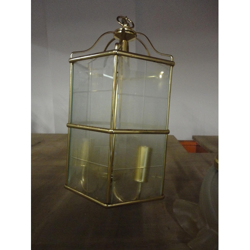 577 - Three near matching brass lantern-style ceiling lights and a three-branch electrolier.  (4)