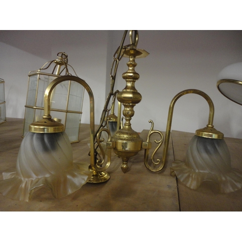 577 - Three near matching brass lantern-style ceiling lights and a three-branch electrolier.  (4)