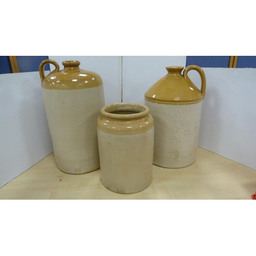 59 - Two stoneware flagons to include Grosvenor of Glasgow one gallon, Hunt's of Liverpool one gallon and... 