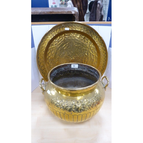 60 - Brass jardinière with mask handles and impressed with foliage, and a brass wall charger.  (2)