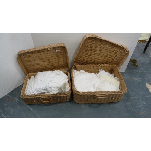 71 - Two wicker baskets containing a quantity of linen.