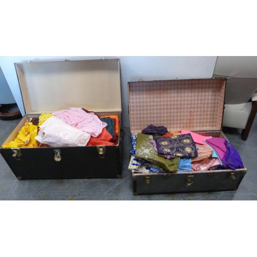 73 - Two trunks containing a large quantity of fabrics to include Middle Eastern-style silks, satins, bea... 