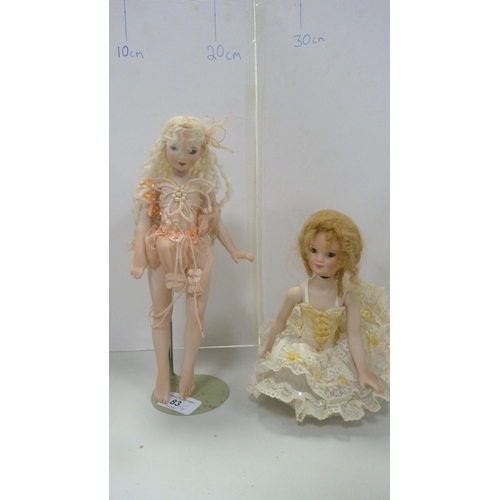 83 - Four bisque china dolls, in assorted dress.  (4)