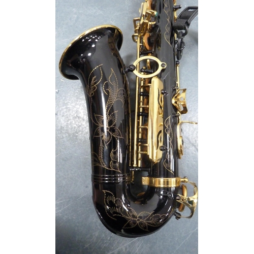 96 - Ammoon alto saxophone with accessories, book and fitted case.