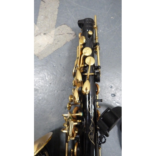 96 - Ammoon alto saxophone with accessories, book and fitted case.