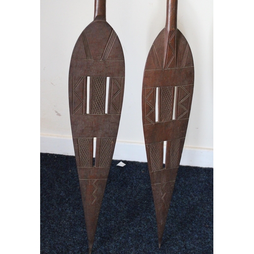 564 - Carved African paddles.