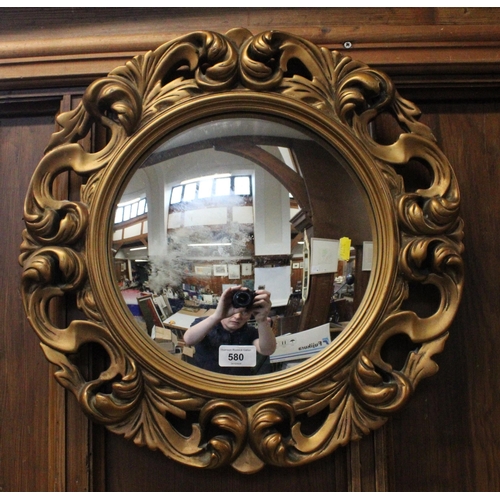 580 - Gilt framed circular wall mirror, 47cm diameter.