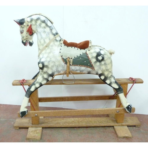 344 - Dapple grey painted rocking horse in the manner of Haddon, with horse hair mane, fixed to a wooden c... 