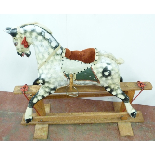 344 - Dapple grey painted rocking horse in the manner of Haddon, with horse hair mane, fixed to a wooden c... 