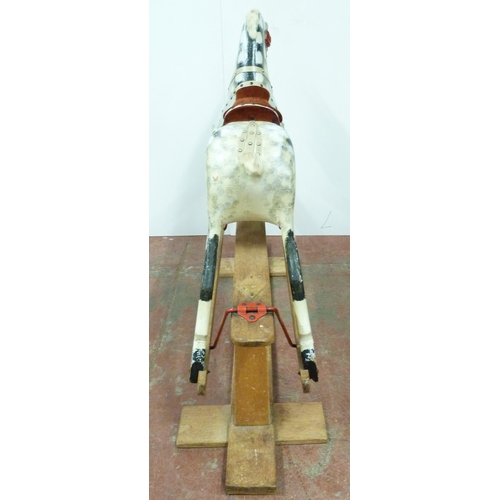 344 - Dapple grey painted rocking horse in the manner of Haddon, with horse hair mane, fixed to a wooden c... 