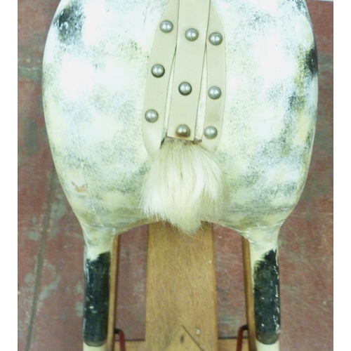 344 - Dapple grey painted rocking horse in the manner of Haddon, with horse hair mane, fixed to a wooden c... 