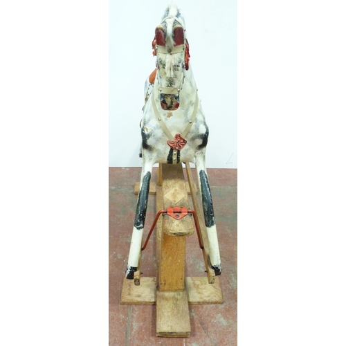 344 - Dapple grey painted rocking horse in the manner of Haddon, with horse hair mane, fixed to a wooden c... 