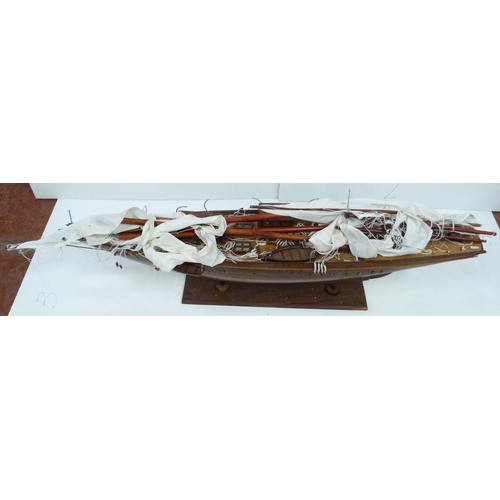 342 - Large scratch-built wooden pond yacht with masts, small boats to the deck, fixed to a plinth stand, ... 