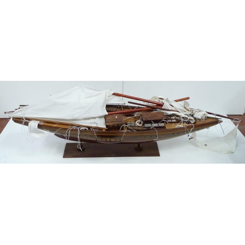 342 - Large scratch-built wooden pond yacht with masts, small boats to the deck, fixed to a plinth stand, ... 