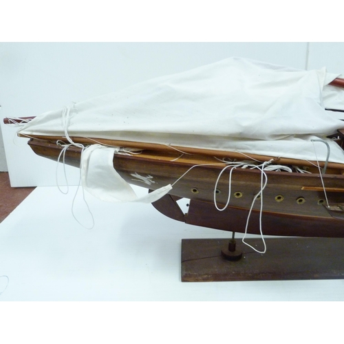 342 - Large scratch-built wooden pond yacht with masts, small boats to the deck, fixed to a plinth stand, ... 