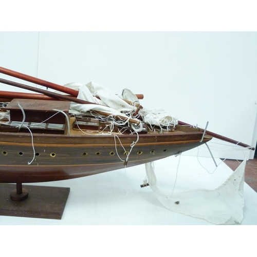 342 - Large scratch-built wooden pond yacht with masts, small boats to the deck, fixed to a plinth stand, ... 