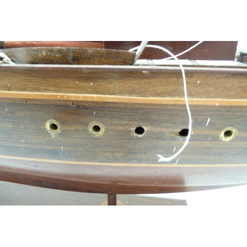 342 - Large scratch-built wooden pond yacht with masts, small boats to the deck, fixed to a plinth stand, ... 