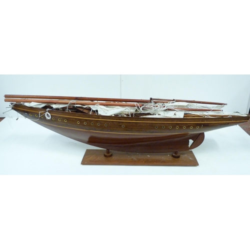 343 - Large scratch-built wooden pond yacht with masts, small boats to the deck, fixed to a plinth stand, ... 